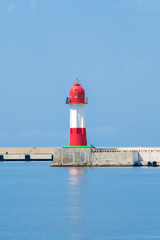 red-white lighthouse at sea