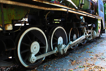 The wheels of an old, ancient steam locomotive that was parked