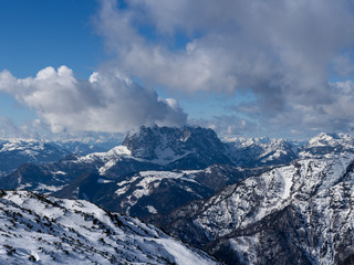 Fototapeta premium beautiful panoramic view over the Austrian Alps to the Wilder Kaiser mountain, blue sky with some clouds