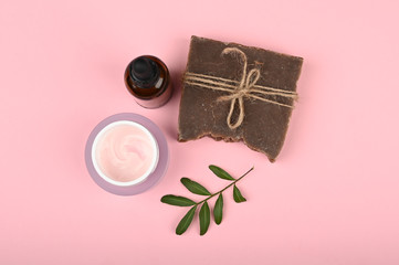 Flat lay on eco cosmetics. Flat layout with accessories, spa cosmetics, bath salt, cream and towels. Skin care product, natural cosmetics, flat styling.
