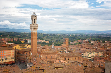 Fototapeta na wymiar Siena,Top view of the Old Town - Piazza del Campo, Palazzo Pubblico di Siena, Torre del Mangia. Tuscany, Italy.