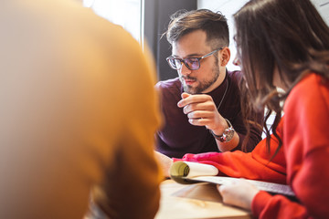 Waiter Takes Order From a young Couple	