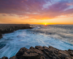 beautiful and dramatic sunset on a craggy rocky cliff, Jandia Peninsula, Fuertaventura