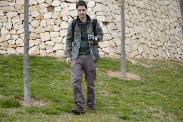 young boy with photo camera in hand