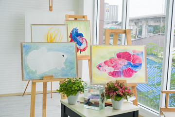 Artistic work of the painter who set up his beautiful fish painting. portfolio at his studio.