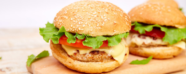 Banner of Craft beef burger on wooden table on light background