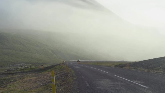car driving on road in northern Iceland duat sunrise during summer. filmed in 4k