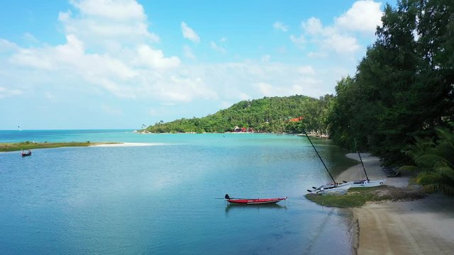 Fishing boats in the beautiful sandy beach. aerial tropical background, Thailand