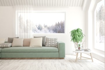 Modern living room in white color with sofa and winter landscape in window. Scandinavian interior design. 3D illustration