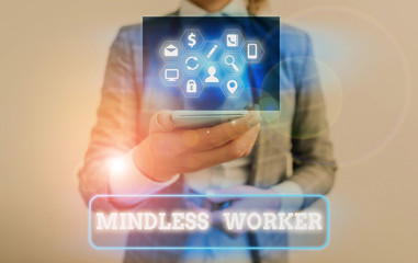 Conceptual hand writing showing Mindless Worker. Concept meaning Having no intelligent purpose...
