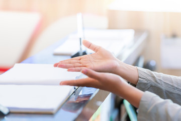 Visitor officer on the receptionist desk with a guest book