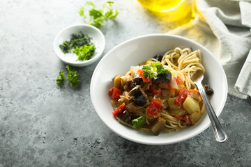 Spaghetti with vegetable ragout and fresh parsley