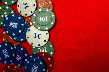 Poker chips on a red background