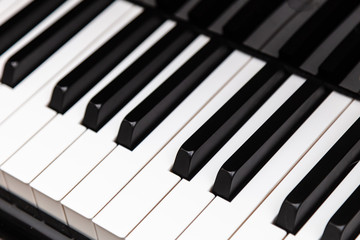 Closeup of upright piano keyboard