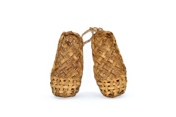 Russian traditional ancient bast shoes made of bast isolated on white background