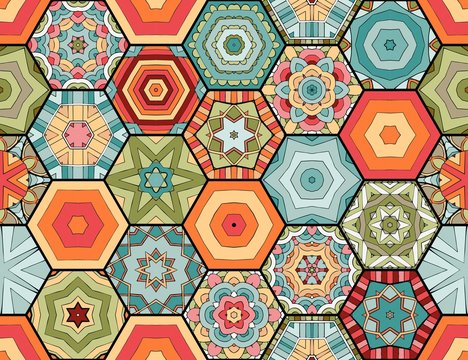Colorful seamless patchwork pattern. Quilt blanket. Bright hexagonal tiles with abstract ornament.
