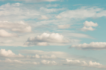 soft white clouds formation on light blue pastel sky
