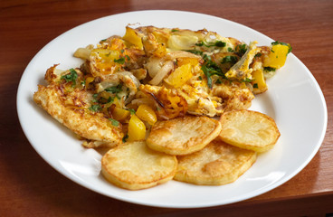 omelet with vegetables, fried potatoes. homemade food