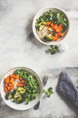 Vegan lunch bowl with rice, broccoli, sweet potato, rice and salad, top view, copy space. Vegan food concept.
