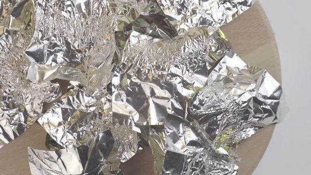 Crumpled candy wrappers and foil