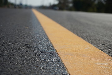Yellow traffic on the road surface in Thailand