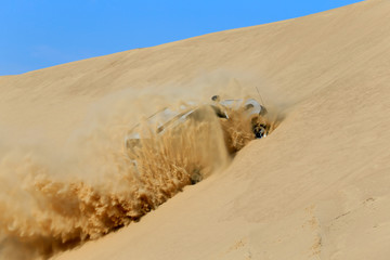 An suv was driving through the desert