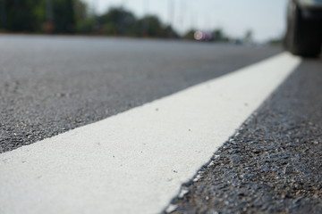White traffic lane dividing line in Thailand