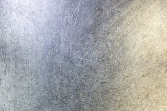 scratched flat stainless steel sheet surface background and texture