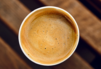 coffee foam in a disposable cup - 325676141
