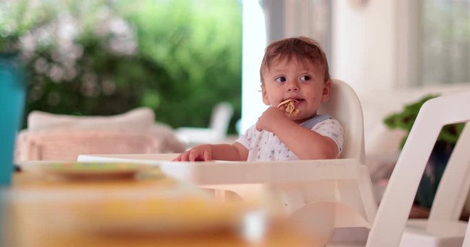 Adorable baby infant toddler on highchair