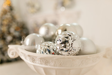 christmas silver balls in a white pot