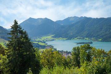 Fototapeta na wymiar idyllic mountain landscape upper bavaria, view to Brecherspitze and lake Schliersee, green trees in may