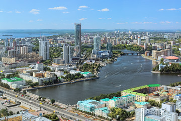 Fototapeta premium Yekaterinburg, Russia. Historical center, city pond, Yekaterinburg-City neighborhood and north-western side of the city. View from observation deck of Vysotsky skyscraper at 186m above the ground.