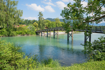 wooden bridge over Mangfall river, beautiful bavarian landscape in june, tourist resort Gmund