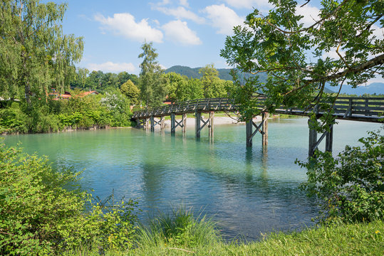 wooden bridge over Mangfall river, beautiful bavarian landscape in june, tourist resort Gmund