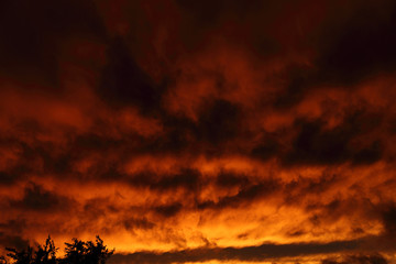 Fire clouds before sunset. Apocalyptic sky