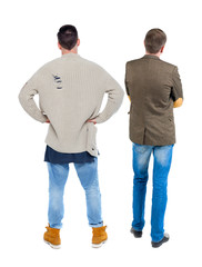 Back view two man in sweater.