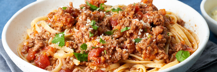 Pasta Bolognese spaghetti. Long banner with Fettuccine, mincemeat and tomatoes