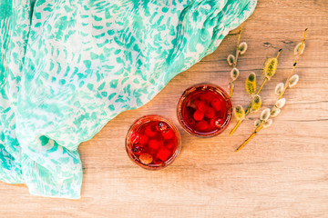 Red cranberry compote and willow on the table