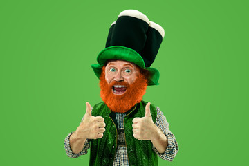 Nice, thumbs up. Excited leprechaun in green suit with red beard on green background. Funny...