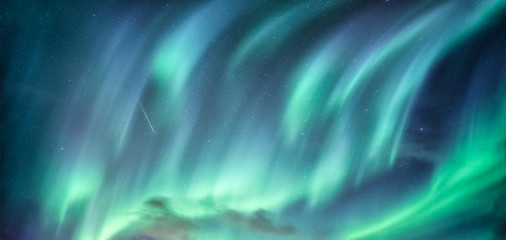 Aurora Borealis, Northern Lights in the night sky on Arctic Circle at Scandinavia © Mumemories