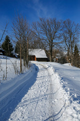 road in a mountain village in the winter