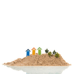 Isolated island with sand and palm tree