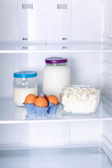 Eggs, milk and cottage cheese in the refrigerator