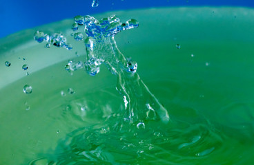 A splash of water in the form of a crown.