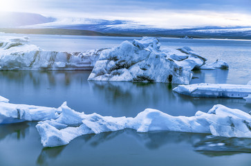 Iceland, Europe. Glacier ice floating on the water with snow at Jokulsarlon glacier lagoon in the winter time © jovannig