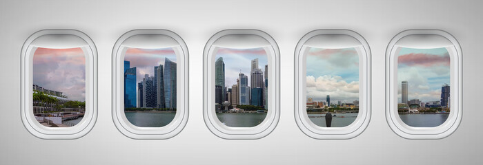 Airplane windows with Singapore skyline view. Travel and holiday abstract concept