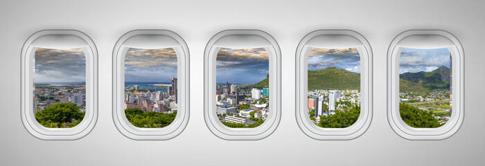 Airplane windows with Port Louis skyline view, Mauritius. Travel and holiday abstract concept