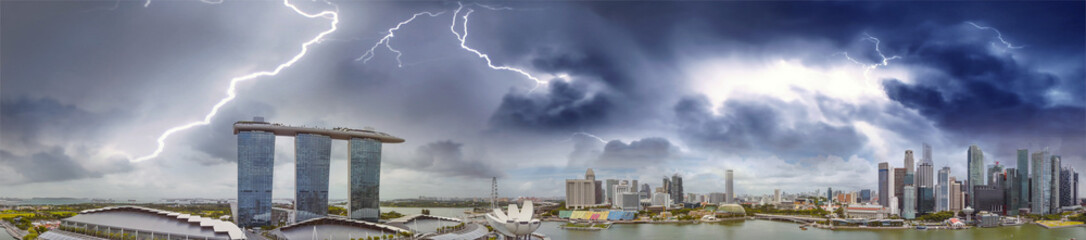 Fototapeta na wymiar Panoramic aerial view of Singapore skyline during a storm