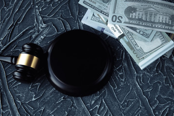 Fototapeta premium Judge Gavel, Scale Of Justice With USa Dollars And Law Book On Judges Table In Courtroom. Conceptual Image To Illustration Bail, Bankruptcy, Fee, Tax, Fraud, Monetary Penalty, Fine And Financial Fraud